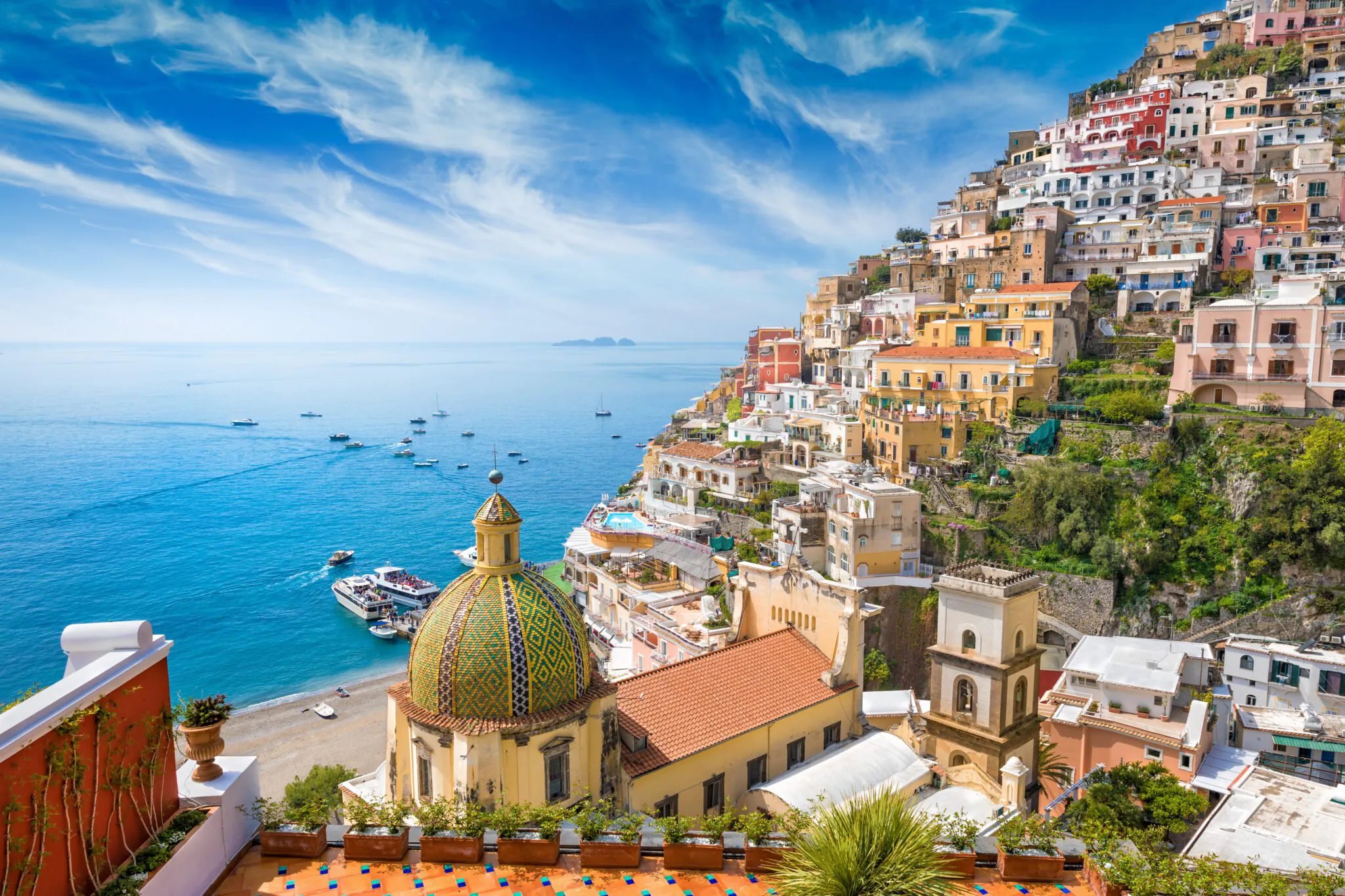 Colorful Positano houses stacked above the Amalfi Coast shoreline